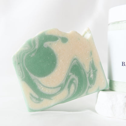 Goat milk eucalyptus mint soap bar with creamy texture and green swirls, ideal for cleansing and moisturizing. goat milk soap
